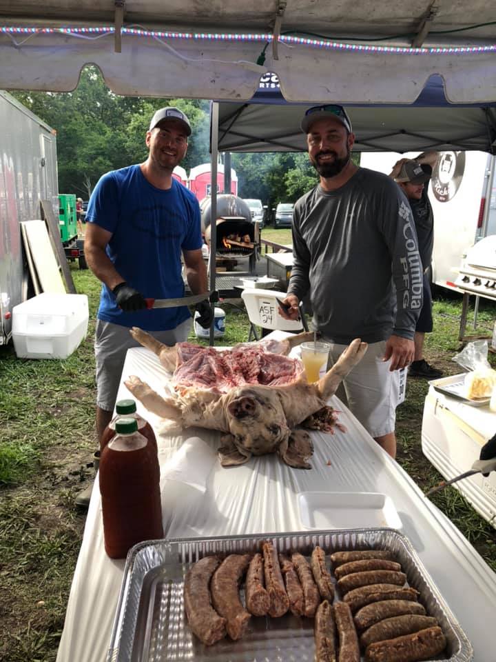 swine and dine team preparing their pig to feast