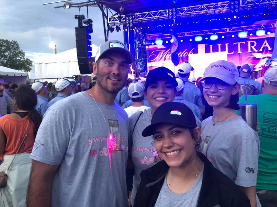 swine and dine team enjoying the music after a long day of cooking