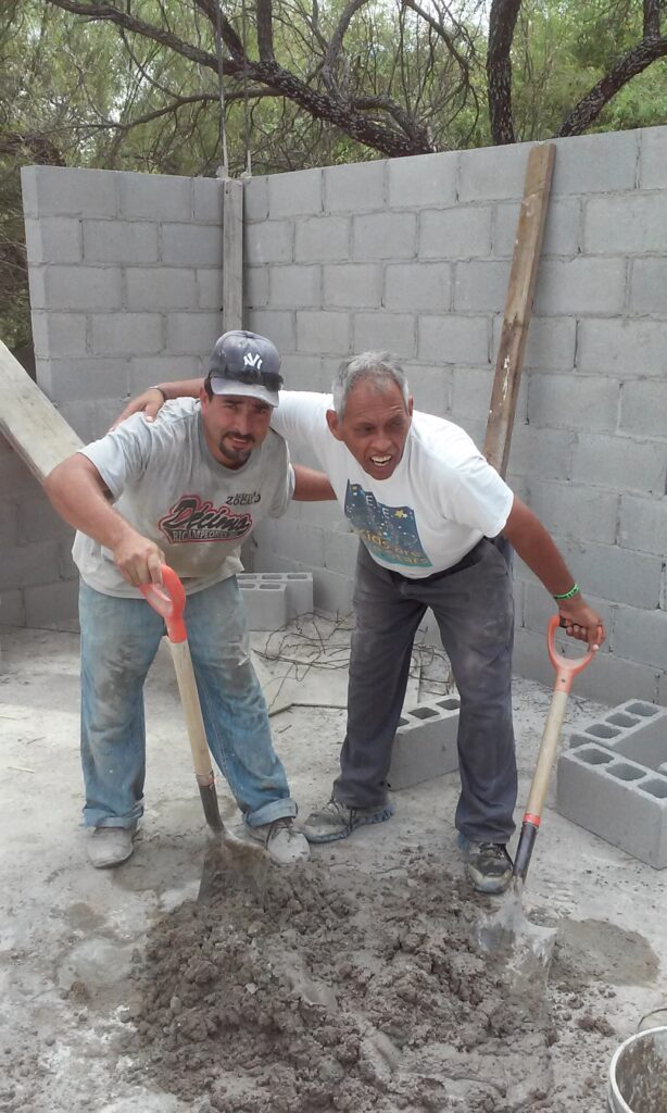 two volunteers pictured working on the casa Bethesda expansion