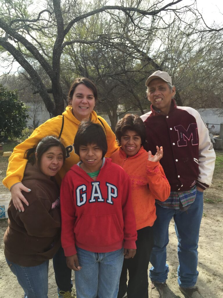 group photo with Tasha, Paulino, and Casa Bethesda residents 