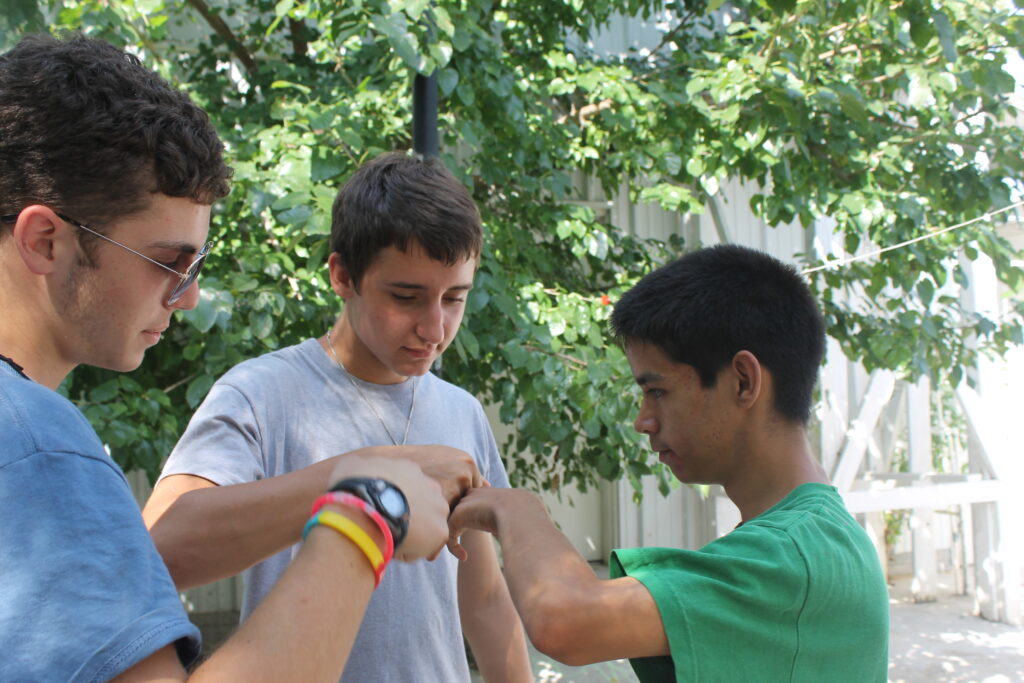 fist bump between volunteer and Casa Bethesda resident