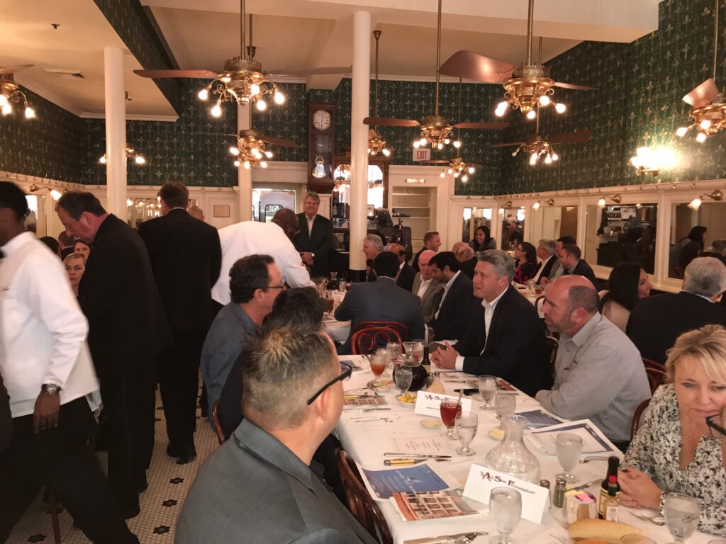 full shot of the guests and waiters at gaslatoire's restaurant during the jazz luncheon