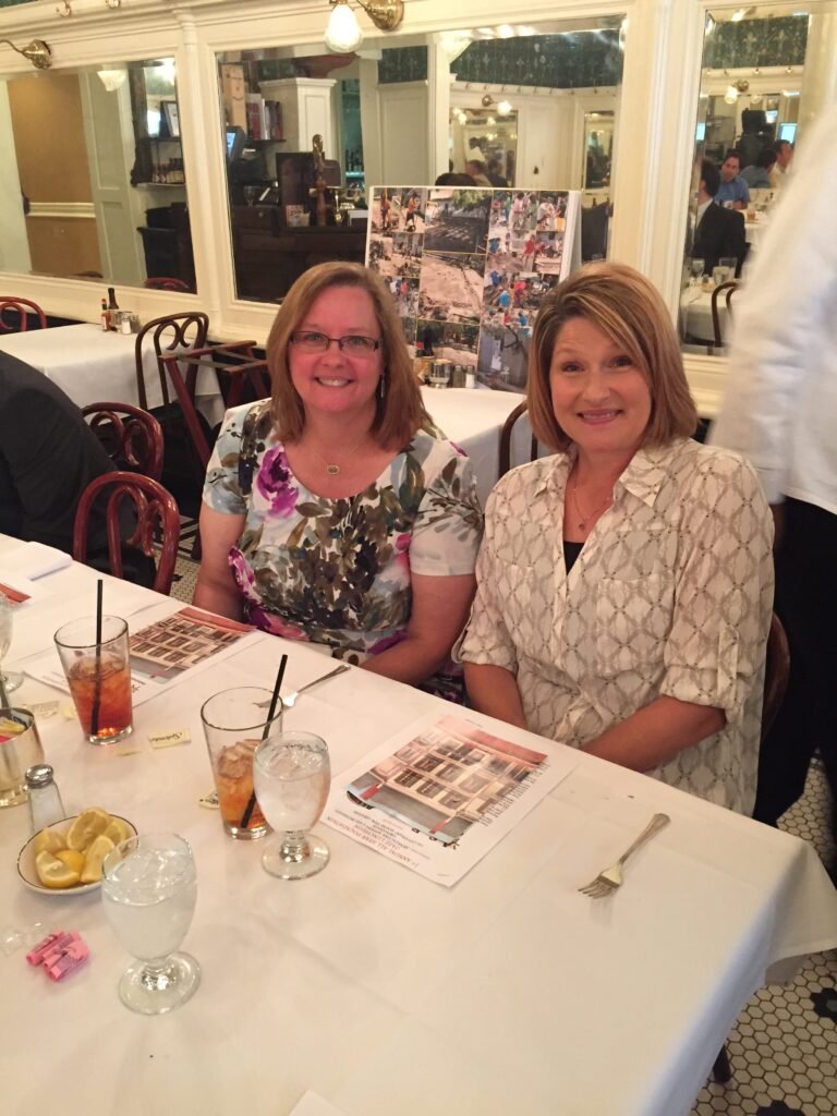 two guests seated side by side ready to order their food